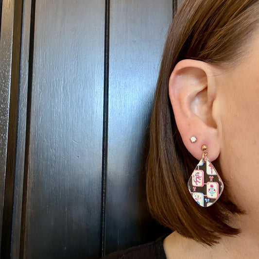Model wearing colorful Lightweight acrylic mahjong tile drop earrings in diamond shape by Half Turn Designs