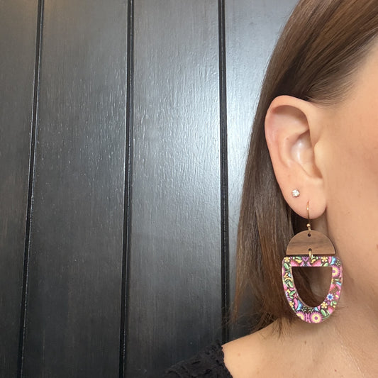 Model wearing Mexican floral wood and acrylic statement earrings by Half Turn Designs