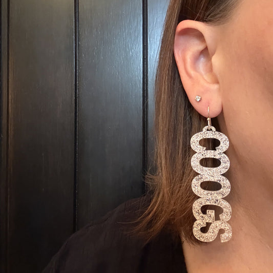 Model wearing University of Houston COOGS earring collection in white glitter with hypoallergenic stainless steel earring hooks by Half Turn Designs