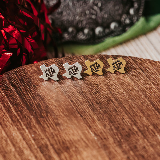 Petite Texas A&M Studs made from stainless steel in gold or silver finish featuring the TAMU logo.