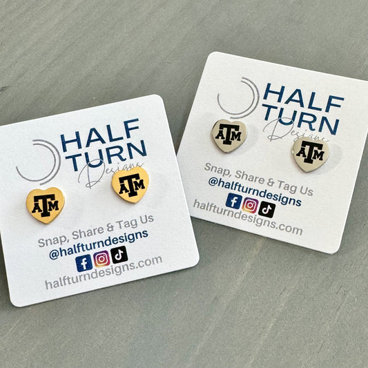 Heart-Shaped Texas A&M Stainless Steel Earring Studs engraved with the Texas A&M logo in gold or silver finish by Half Turn Designs, officially licensed with Texas A&M University.