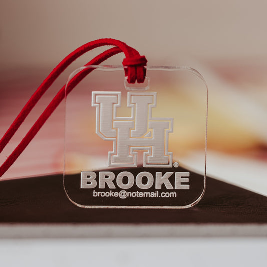University of Houston Cougars Luggage Tags by Half Turn Designs. Square luggage tag made from 1/4" Clear acrylic with red cord.