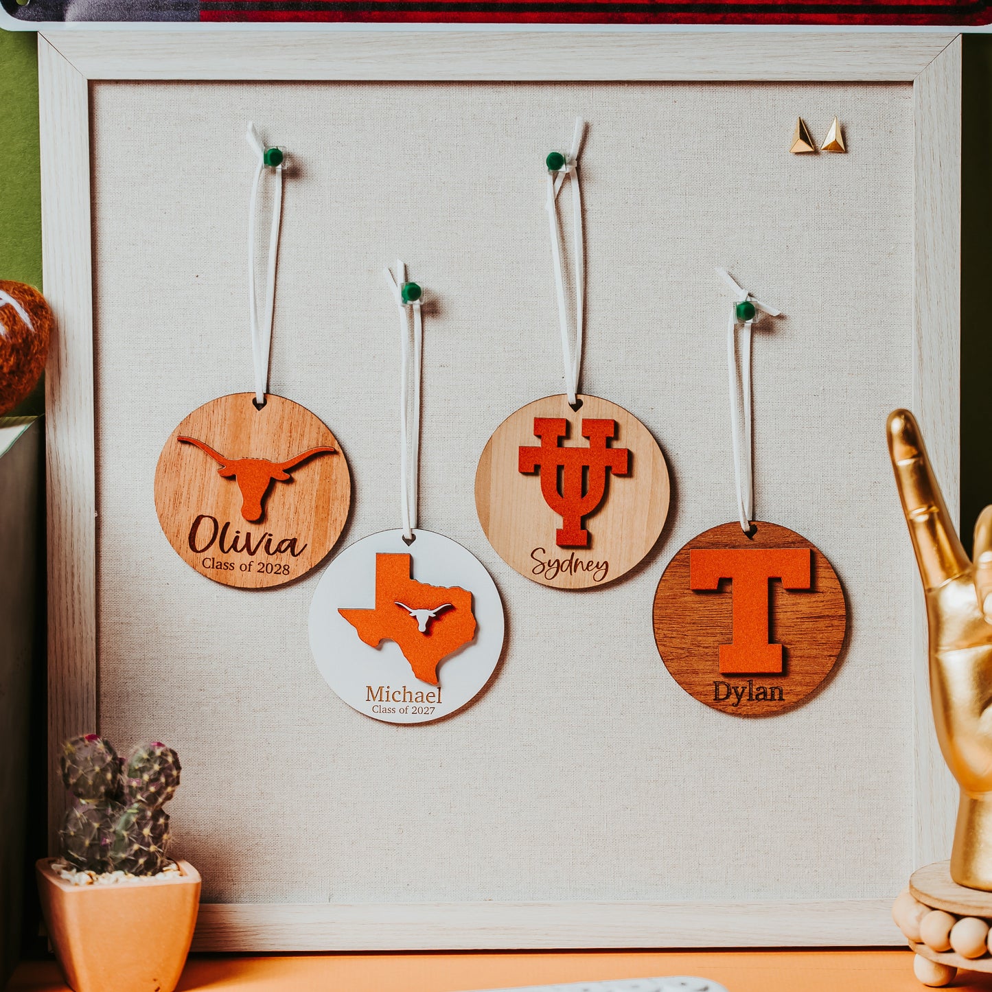 Officially licensed university of texas longhorns personalized ornaments available in four designs and five wood types including white, walnut, cherry, sapele and mahogany.