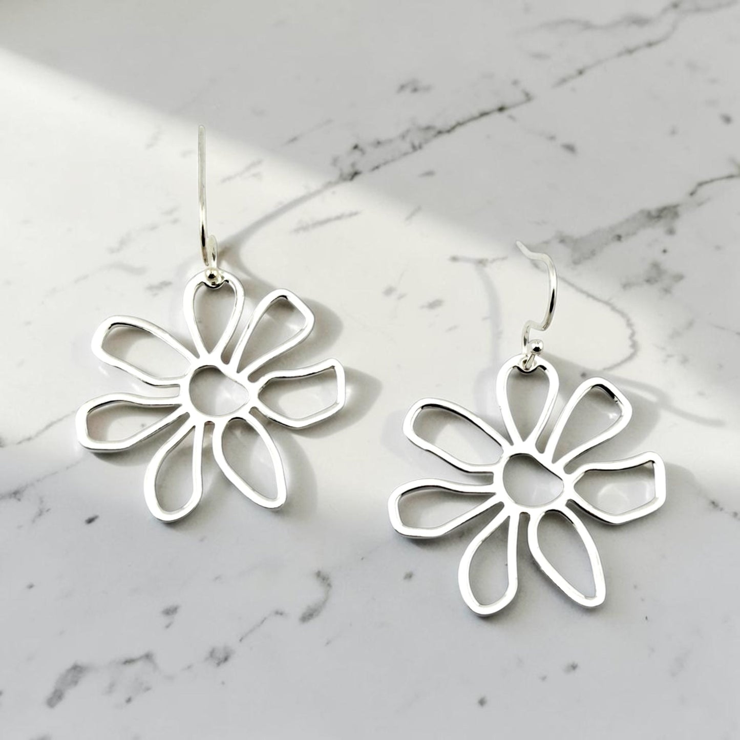 Modern silver daisy dangle earrings with silver stainless steel hooks