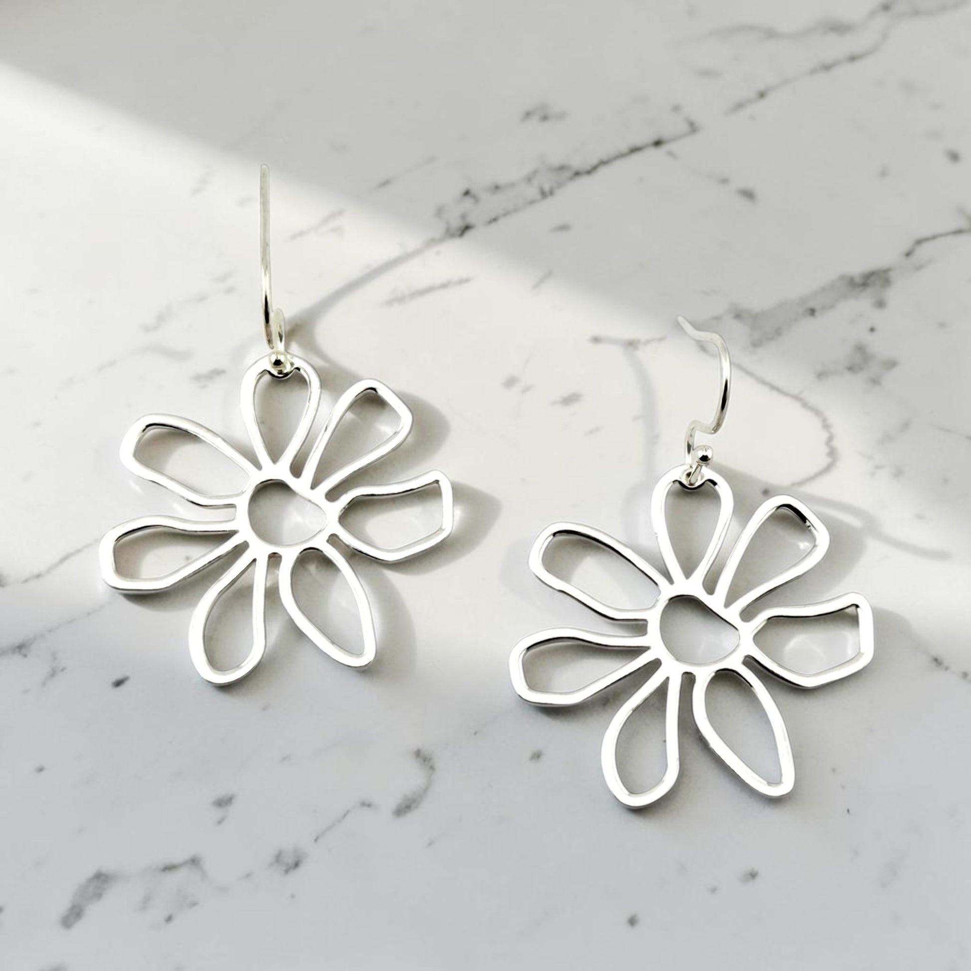 Modern silver daisy dangle earrings with silver stainless steel hooks