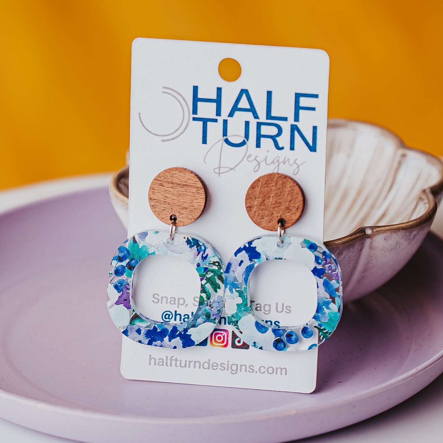 Boho floral acrylic earrings with watercolor blue green and purple flowers and walnut wood studs