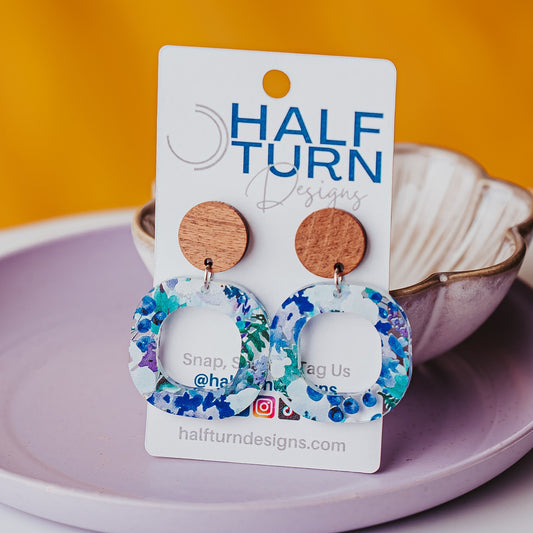 Boho floral acrylic earrings with watercolor blue green and purple flowers and walnut wood studs