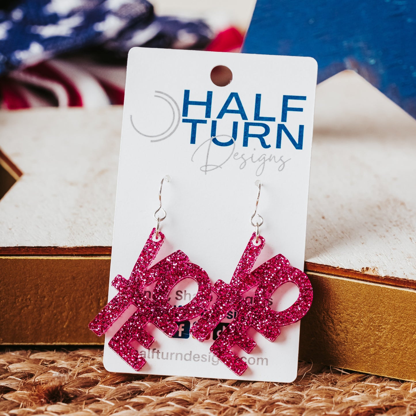 Bright Pink Glitter Vote Earrings with silver-tone earring hooks on a Half Turn Designs Earring Card.
