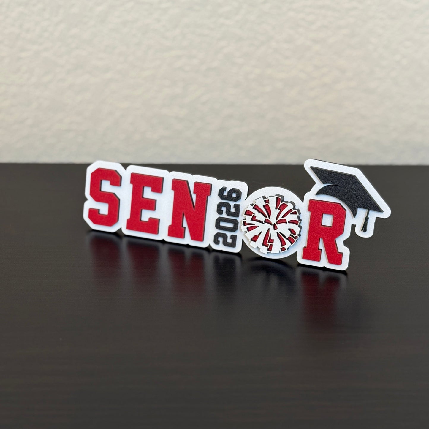 Cheerleading banquet sign for Class of 2026 cheer squad. Shown here in white wood with red accents.