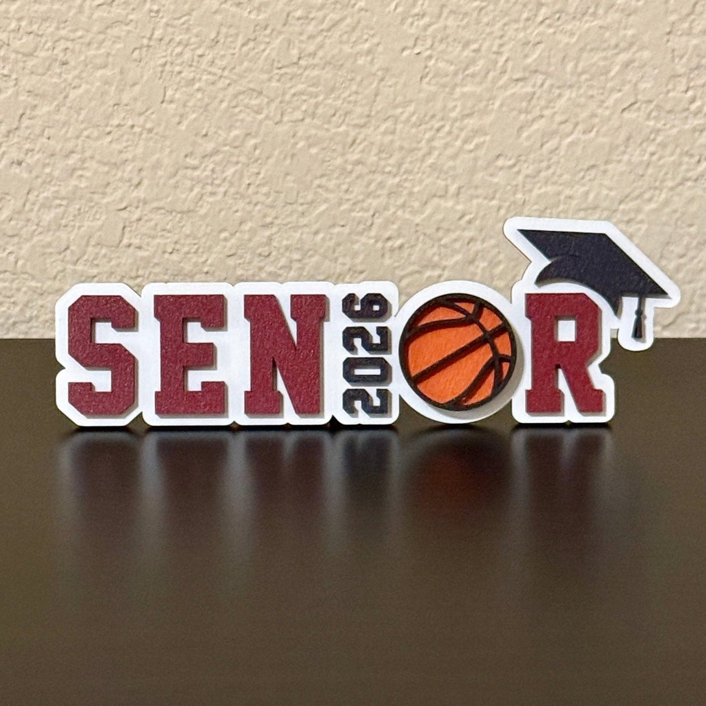 Class of 2026 senior basketball sign with basketball graphic and graduation cap, custom school colors, graduation party and high school basketball banquet decor