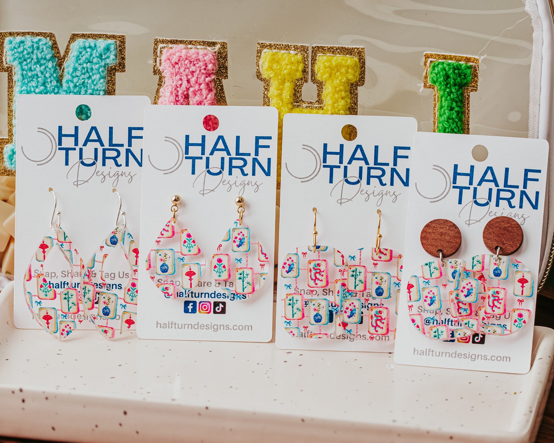 Half Turn Designs collection of colorful acrylic mahjong dangle earrings