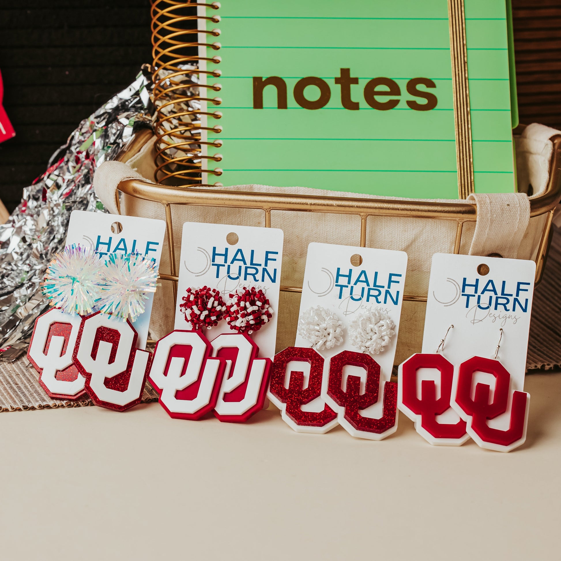 Officially licensed University of Oklahoma game day earring collection by Half Turn Designs. These earrings are available in combinations of crimson and white acrylic, including glitter. Available in a eight different fun toppers for OU game days and as a gift for your favorite Oklahoma Sooner.