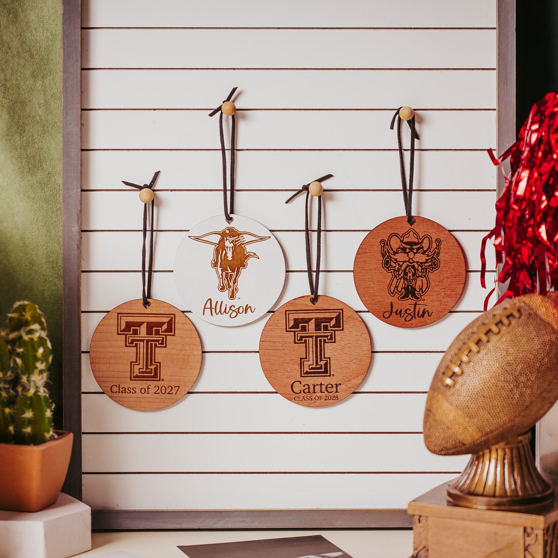 Half Turn Designs collection of Officially Licensed Texas Tech University round wooden ornament with engraved TTU logo and 1-2 lines of personalized text. Available in cherry, mahogany or white wood finishes.