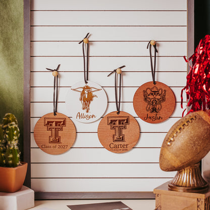 Half Turn Designs collection of Officially Licensed Texas Tech University round wooden ornament with engraved TTU logo and 1-2 lines of personalized text. Available in cherry, mahogany or white wood finishes.