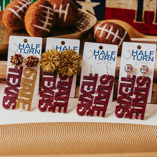 Half Turn Designs Collection of Officially licensed Texas State dangle earrings in maroon glitter and gold glitter