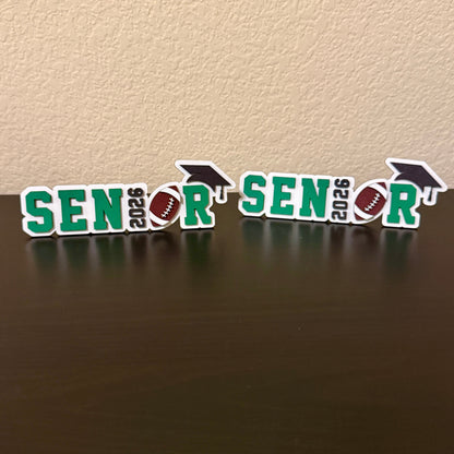 Two Class of 2026 football signs available in white wood shown with green accent colors.  