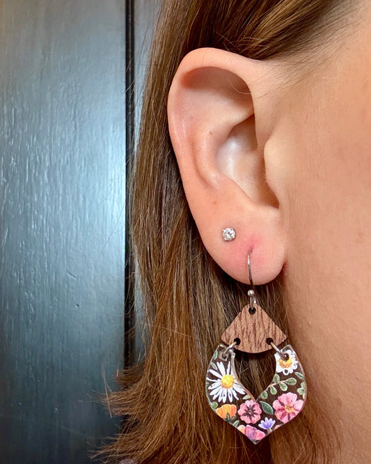 Model wearing Wildflower acrylic earrings with walnut wood accents on hypoallergenic silver stainless steel earring hooks
