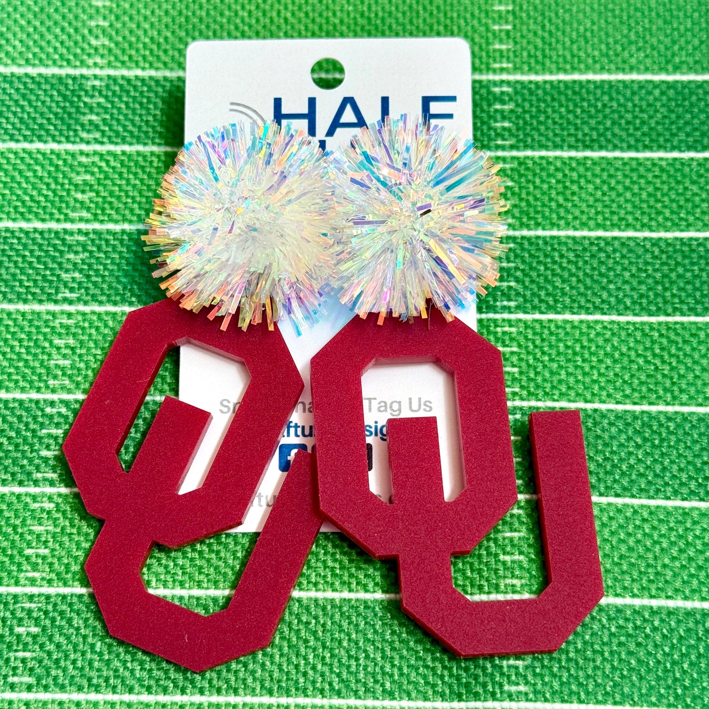 OU Game Day Dangle acrylic earrings in crimson with iridescent tinsel earring toppers. Officially Licensed University of Oklahoma Boomer Sooner earrings by Half Turn Designs.