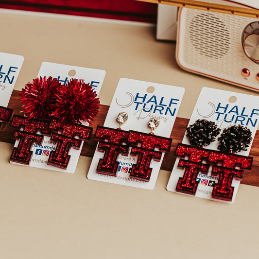 Collection of TTU Red glitter Texas Tech Double T earrings displayed on Half Turn Designs cards with multiple hook and topper styles.