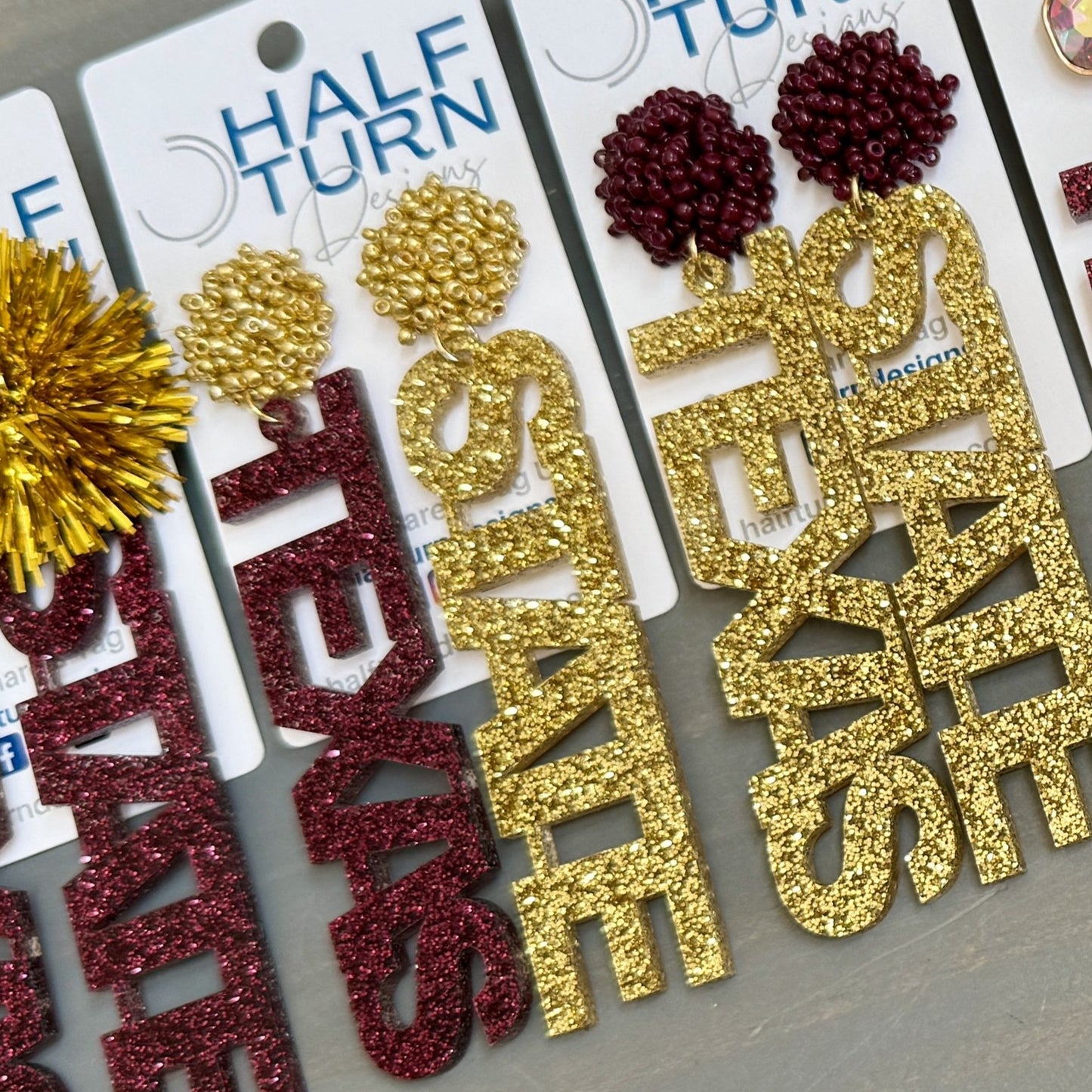Bobcats dangle earrings in mixed maroon and gold glitter acrylic