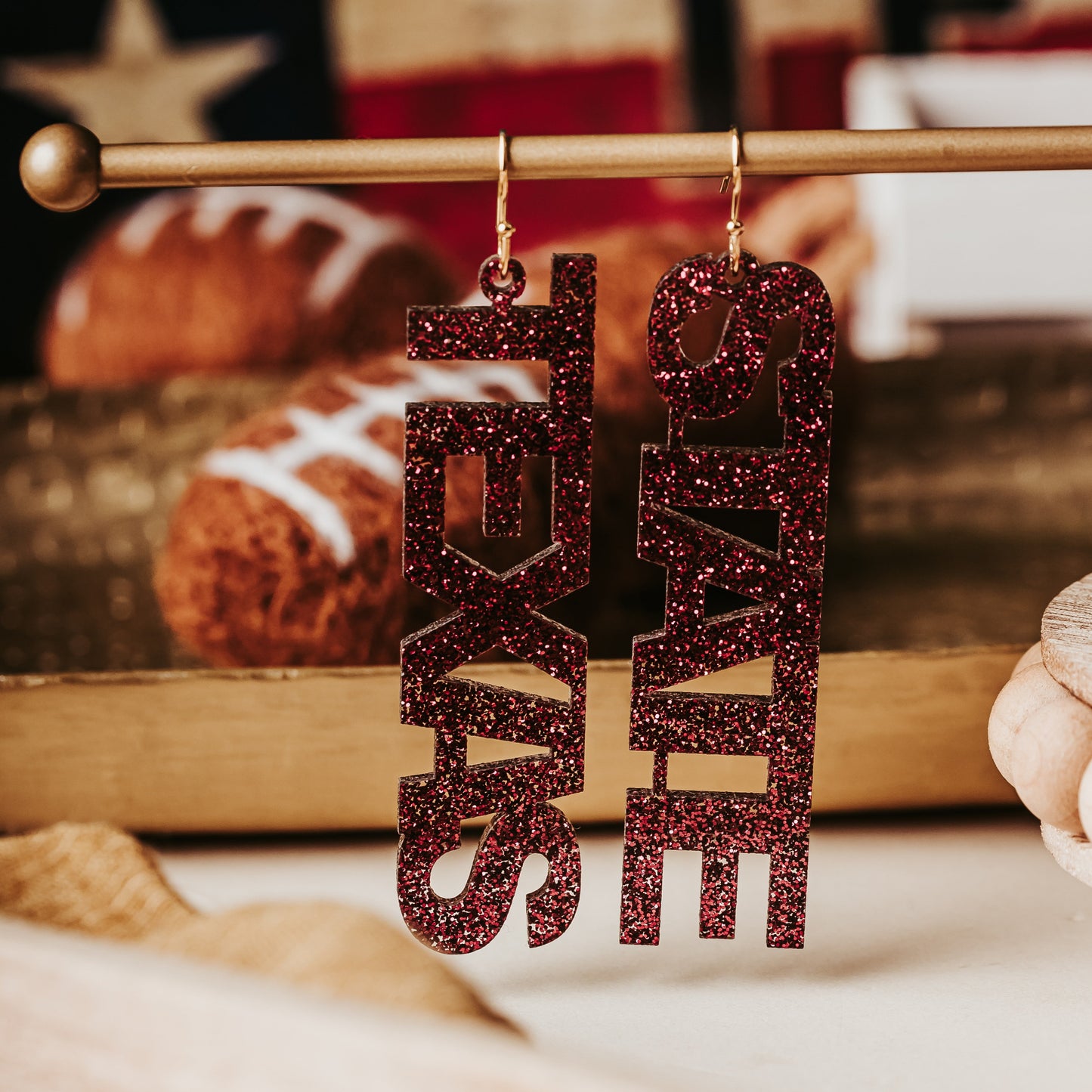 Texas State maroon statement earrings for football season and spirited outfits