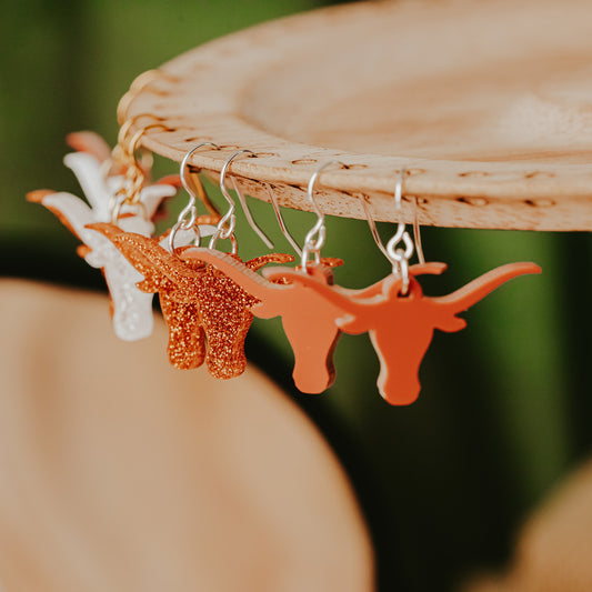 University of Texas burnt orange and white as well as burnt orange glitter and white glitter Longhorn dangle earrings