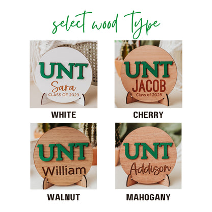 Wood finish options for Font options for Officially licensed University of North Texas 5 inch round wooden dorm decor, shelf sitter and desk sign with the UNT letters in Mean Green, personalized with your choice of 1-2 lines of engraved text in four wood finishes including mahogany, walnut, cherry and white.  Comes with a matching stand.