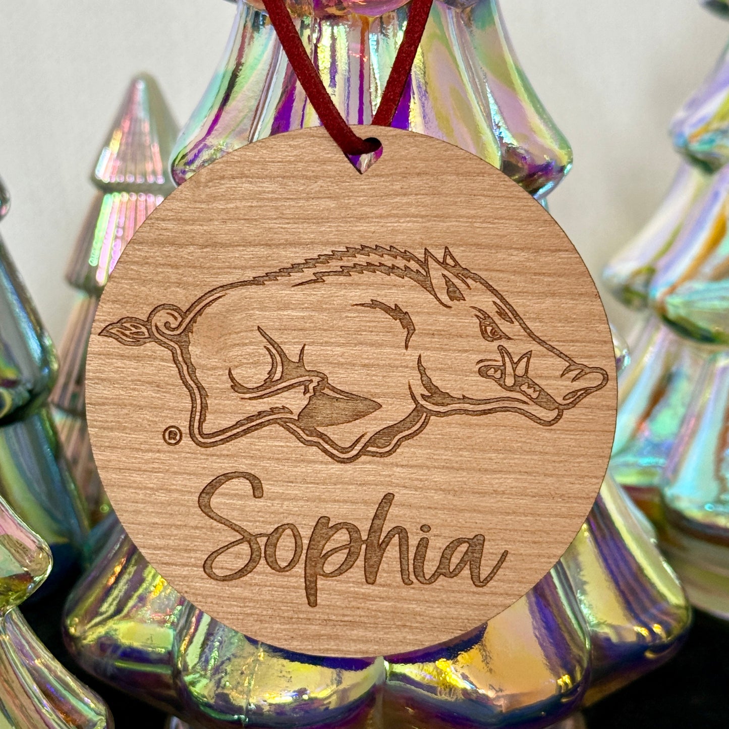 University of Arkansas Razorbacks ornament with UArk  Razorbacks engraved logo and 1-2 lines of personalization. Available in four wood finishes - cherry, mahogany, walnut and white