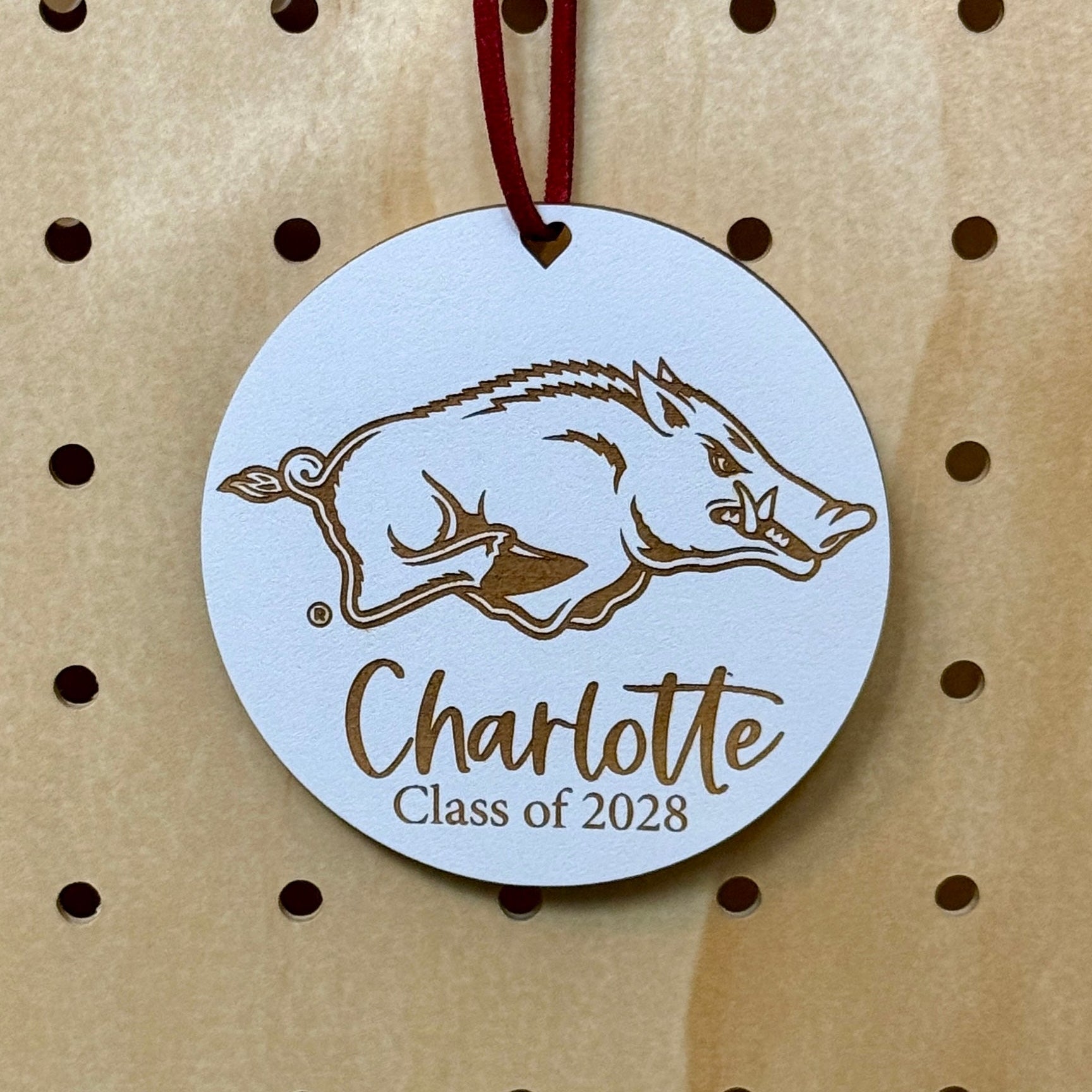 University of Arkansas Razorbacks ornament with UArk  Razorbacks engraved logo and 1-2 lines of personalization. Available in four wood finishes - cherry, mahogany, walnut and white