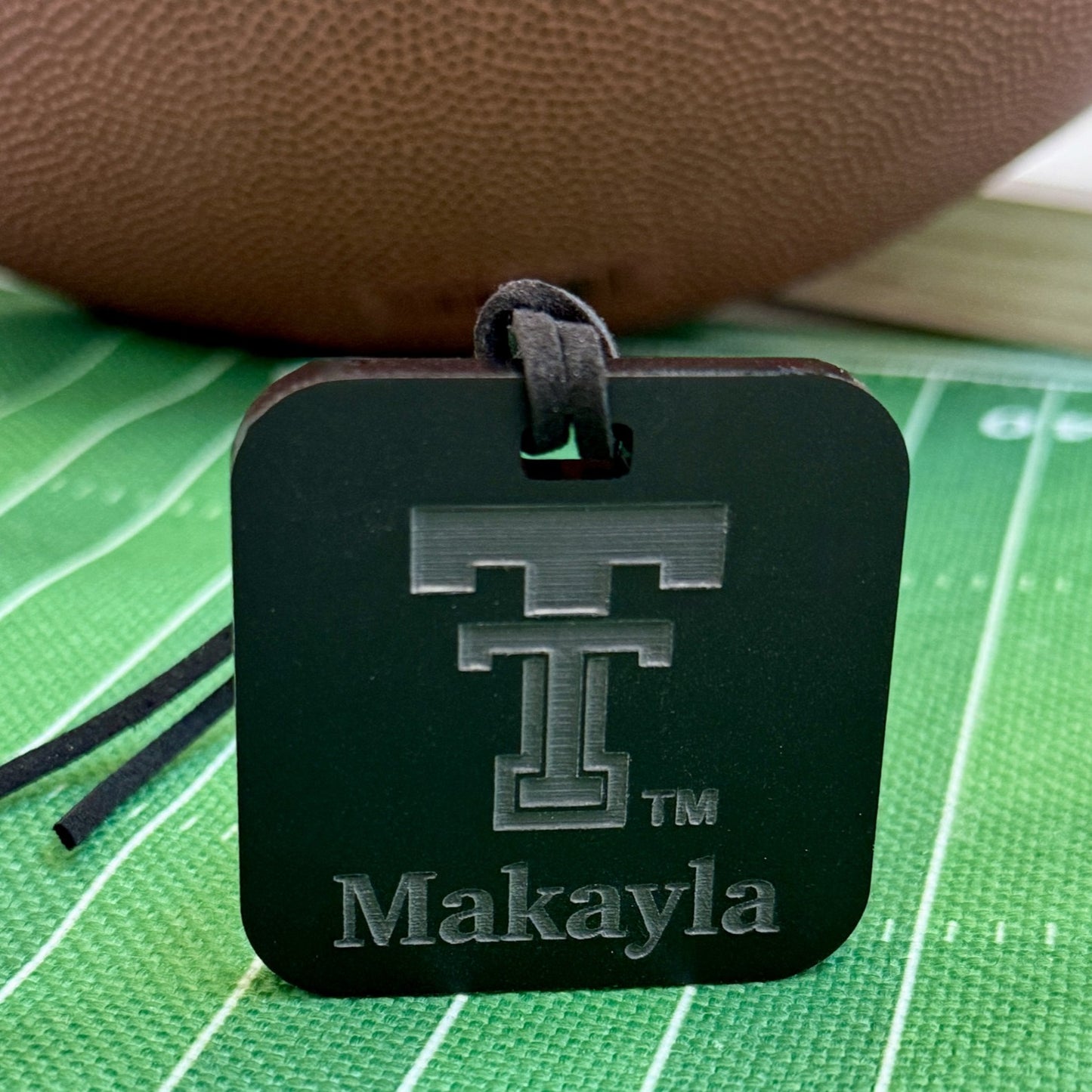 Black acrylic Red Raiders luggage tag with personalized name and information. Officially licensed by Half Turn Designs