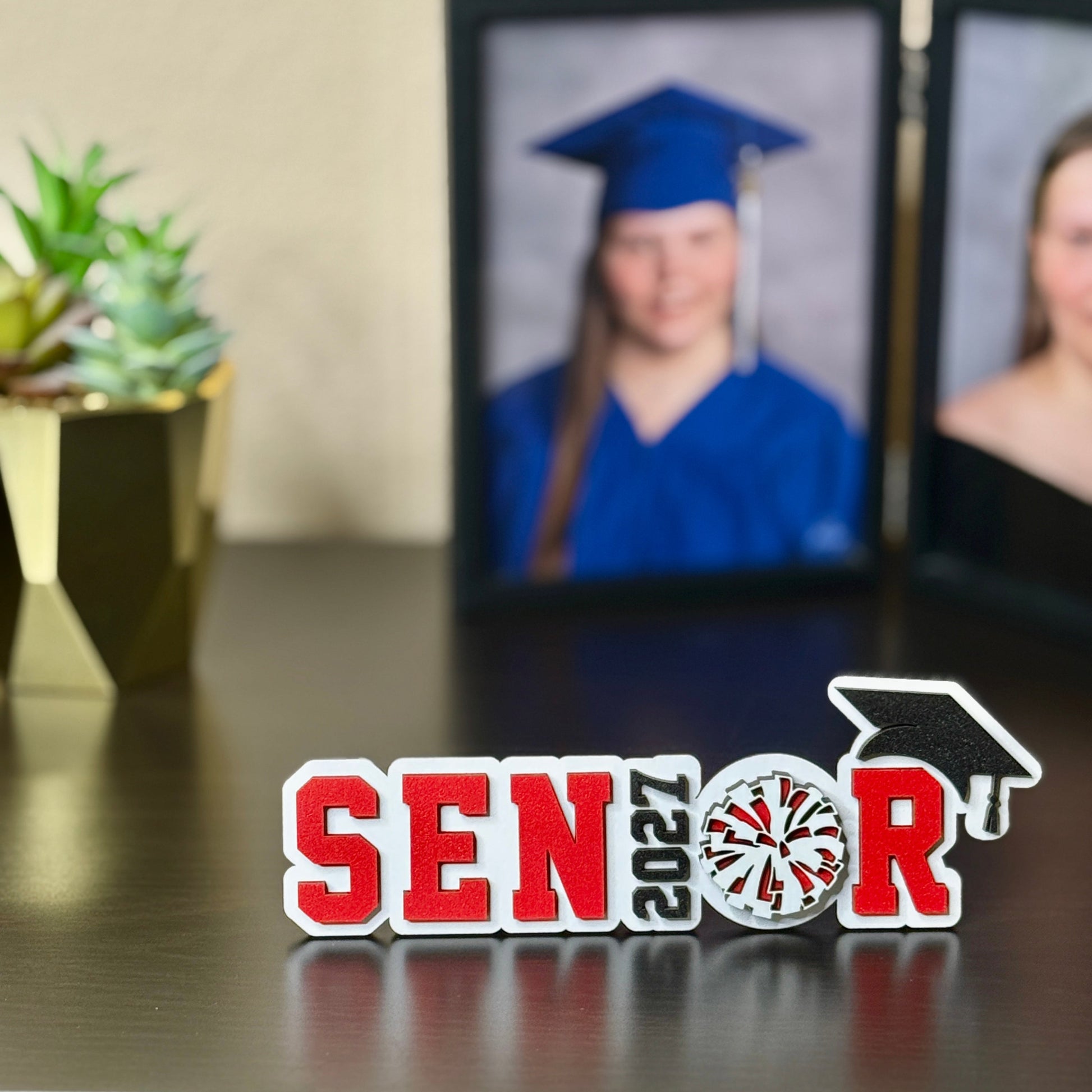 Class of 2027 wooden senior sign for cheer, pom, and drill team with customizable school colors and graduation cap.