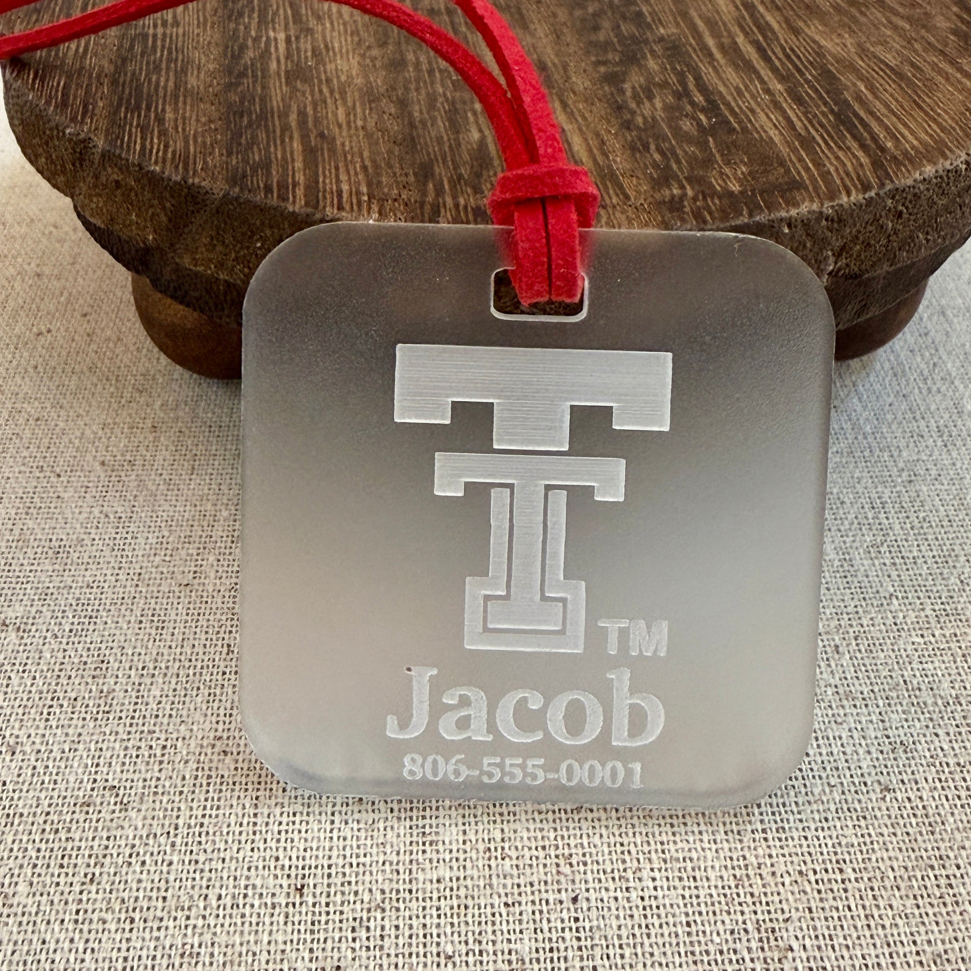Frosted Texas Tech luggage tag with updated logo engraved with customer's information