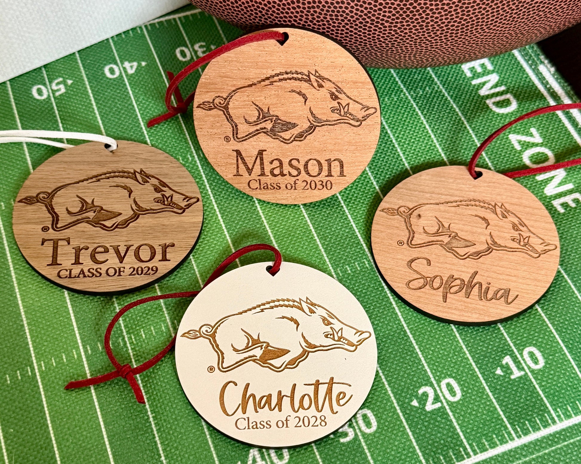 Half Turn Designs Officially Licensed University of Arkansas Razorbacks ornament Collection with UArk  Razorbacks engraved logo and 1-2 lines of personalization. Available in four wood finishes - cherry, mahogany, walnut and white