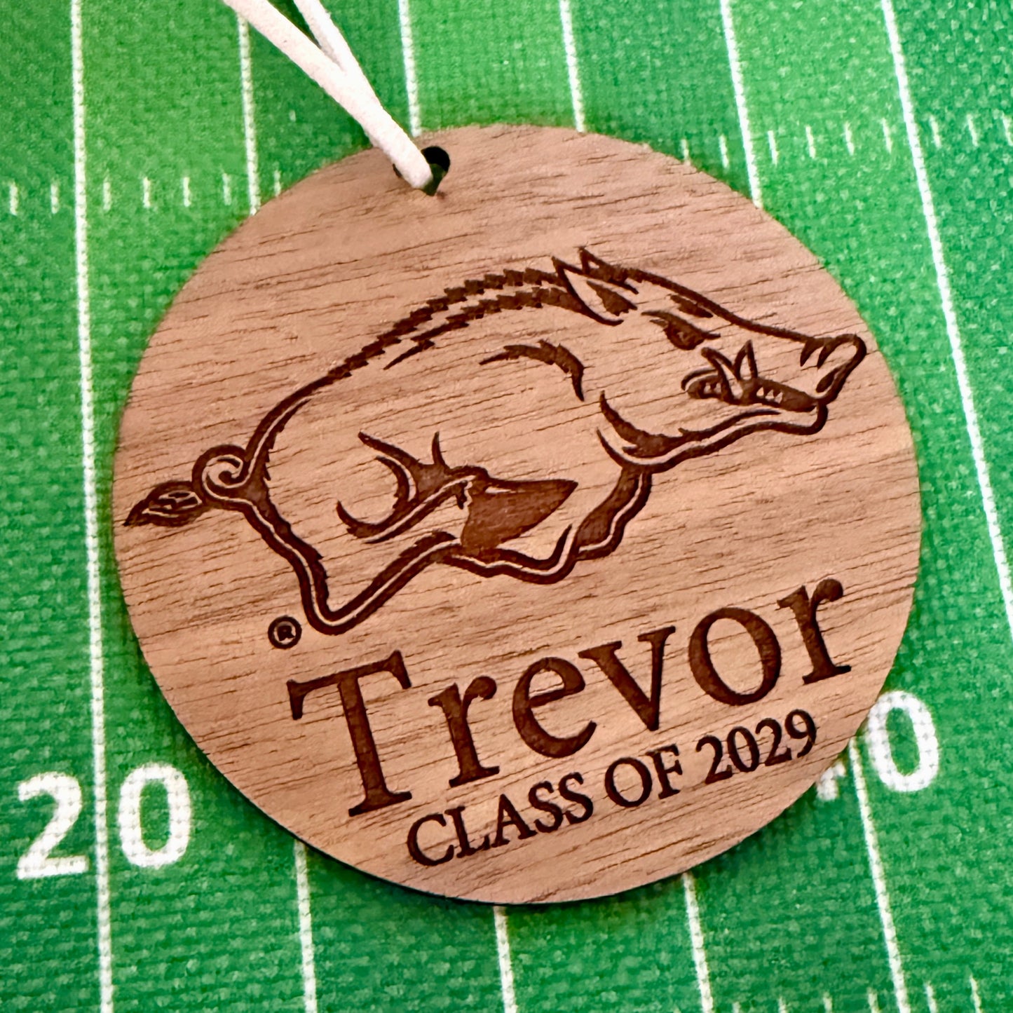 University of Arkansas Razorbacks ornament with UArk  Razorbacks engraved logo and 1-2 lines of personalization. Available in four wood finishes - cherry, mahogany, walnut and white
