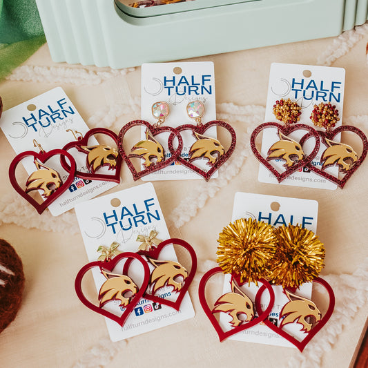 Half Turn Designs Collection of Texas State University Bobcats earrings in TXST Maroon and Gold acrylic.