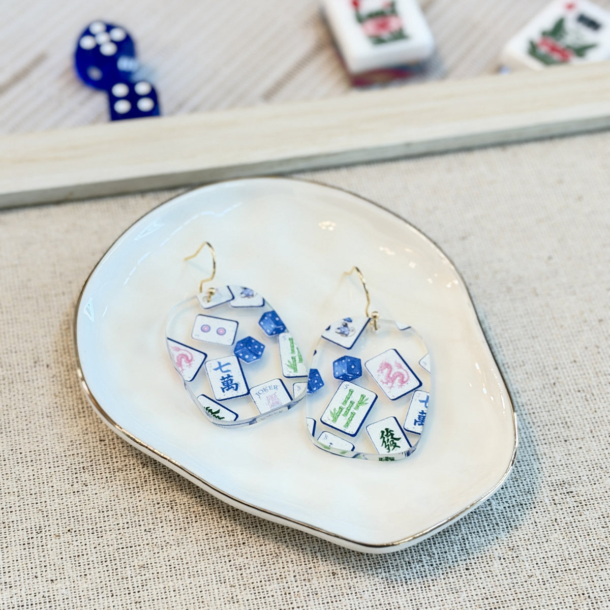 Acrylic mahjong tile earrings printed with Jokers and dice on gold-tone hooks