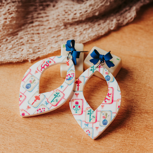 Mahjong lover gift earrings for women, acrylic earrings with colorful mahjong tile print topped with blue bows with stainless steel pin