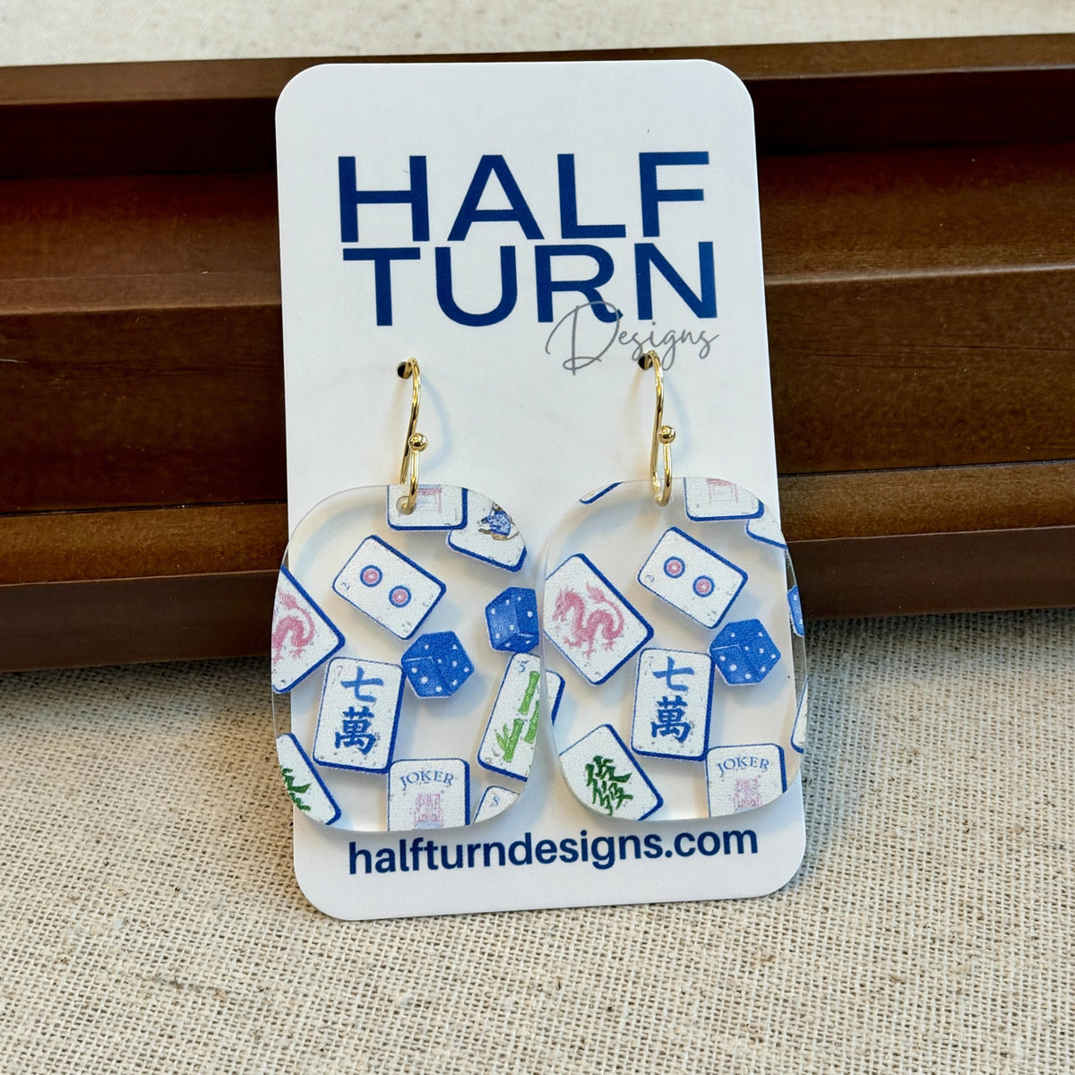 Blue chinoiserie mahjong tile earrings with gold-tone stainless steel earring hooks on Half Turn Designs earring card