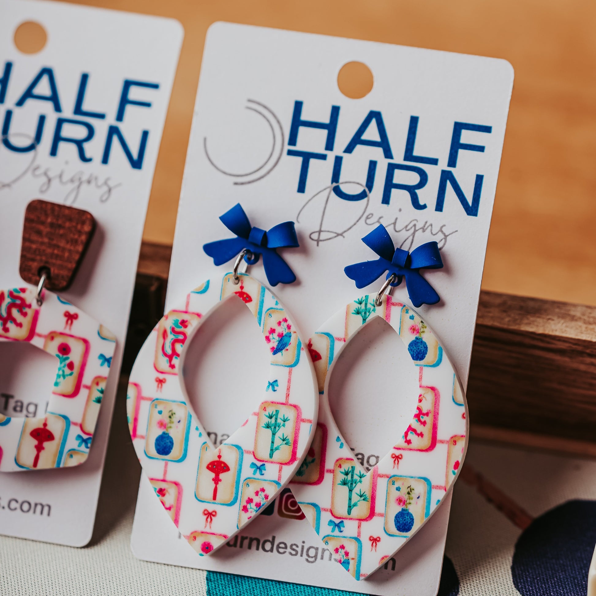 Mahjong tile earrings white acrylic with blue bow on Half Turn Designs earring card