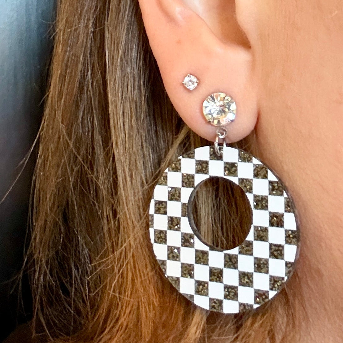 Model wearing White and Black Checkered Circle Dangle Earrings on Rhinestone Studs, Racing Dangle Earrings