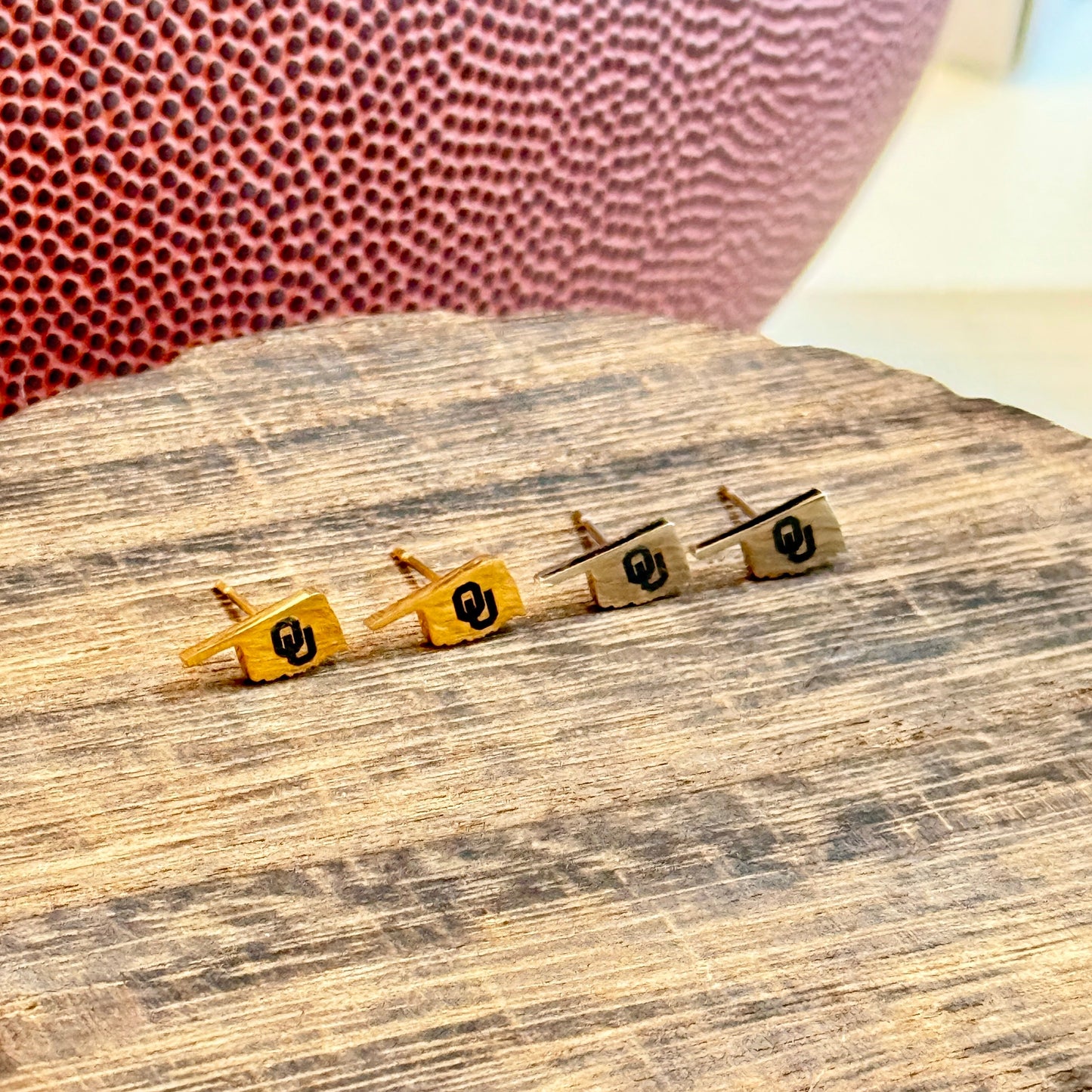 Officially licensed University of Oklahoma hypoallergenic stainless steel earring studs in gold or silver tones.