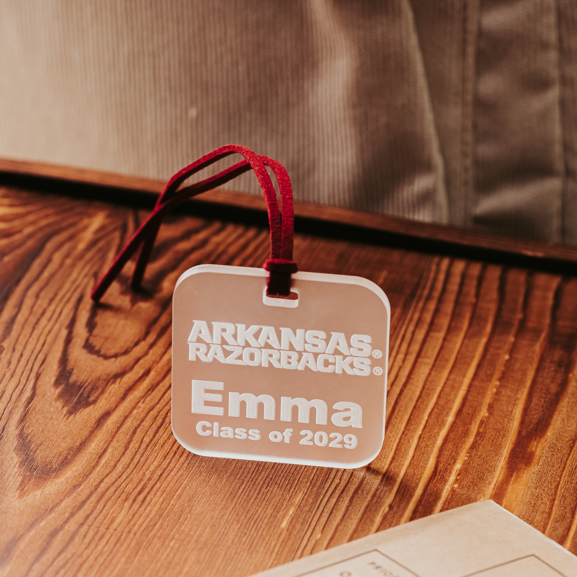 Officially licensed Arkansas Razorbacks acrylic luggage tag, available in frosted, clear, crimson or black, personalized with names and phone numbers. Shown here in frosted acrylic