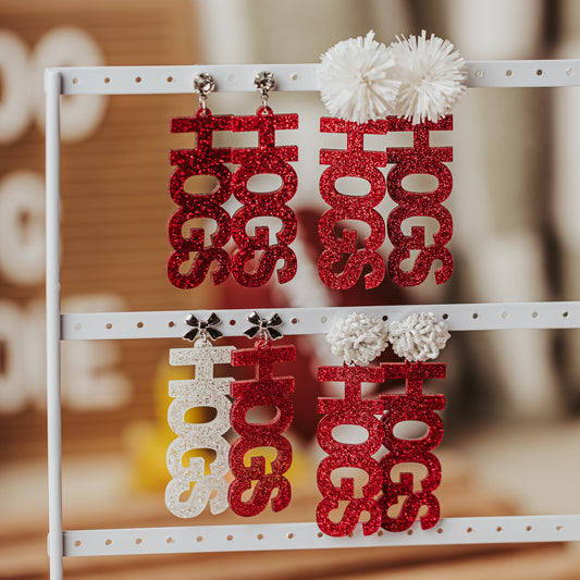 Officially licensed University of Arkansas HOGS game day dangle earrings in crimson and white glitter acrylic by Half Turn Designs.