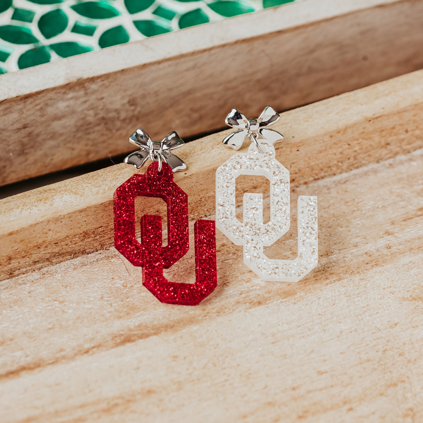 Officially Licensed University of Oklahoma Sooners Earrings in Crimson and White Glitter Acrylic with silver bow studs