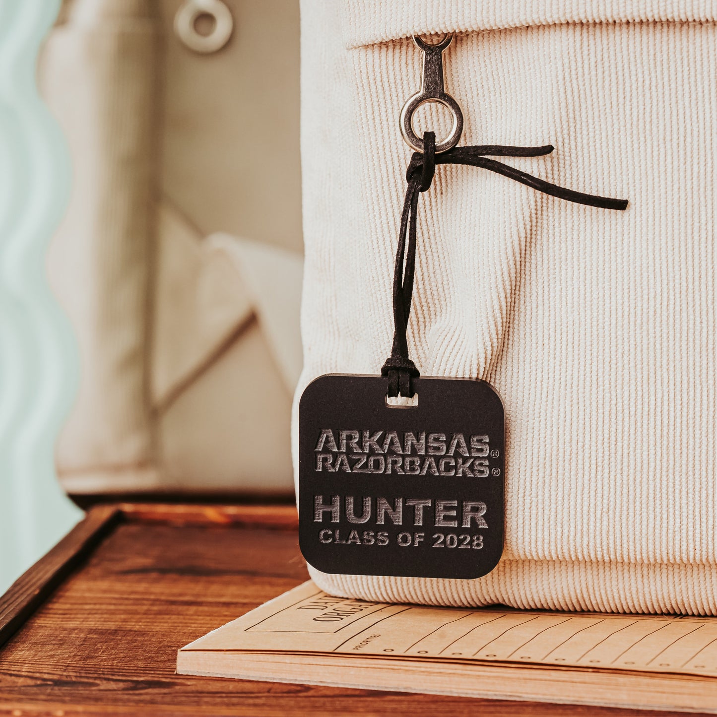 Personalized Arkansas Razorbacks bag tags. Rounded Square 2" luggage tag available in 1/8" or 1/4" acrylic. Shown here in black matte acrylic. Officially licensed by Half Turn Designs