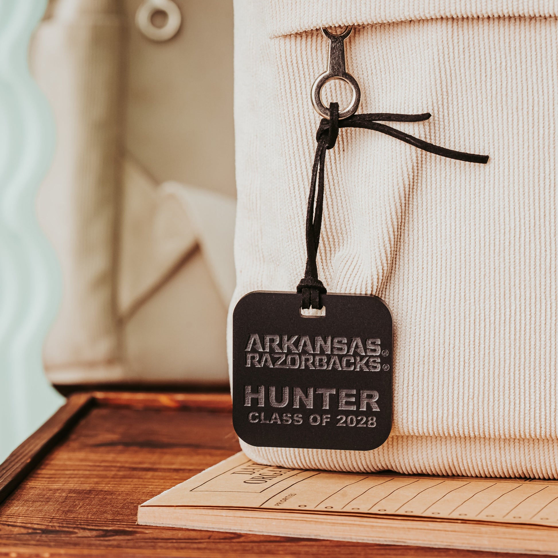 Personalized Arkansas Razorbacks bag tags. Rounded Square 2" luggage tag available in 1/8" or 1/4" acrylic. Shown here in black matte acrylic. Officially licensed by Half Turn Designs