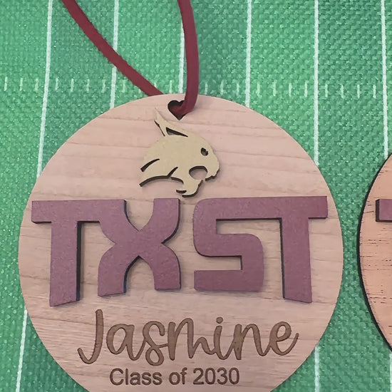 Video of Texas State University TXST and Bobcat wooden engraved Christmas Ornaments