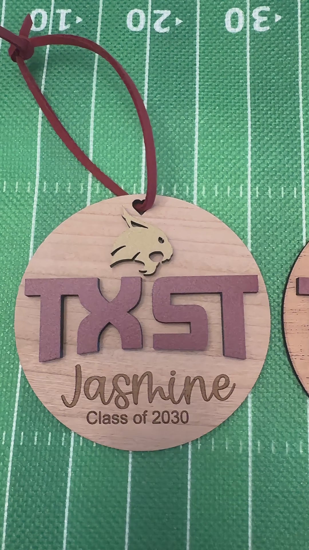 Video of Texas State University TXST and Bobcat wooden engraved Christmas Ornaments