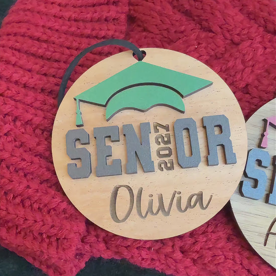 Personalized Senior 2027 Ornaments in 4 wood finishes and 14 school colors, engraved with graduate's name.