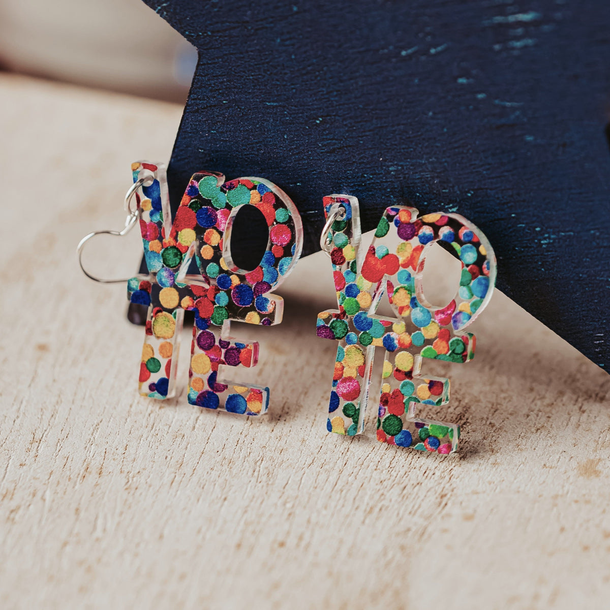 Rainbow dot acrylic VOTE earrings with colorful confetti design
